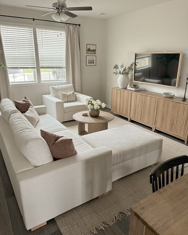 Illustrated living room with yellow sectional sofa and pink rug