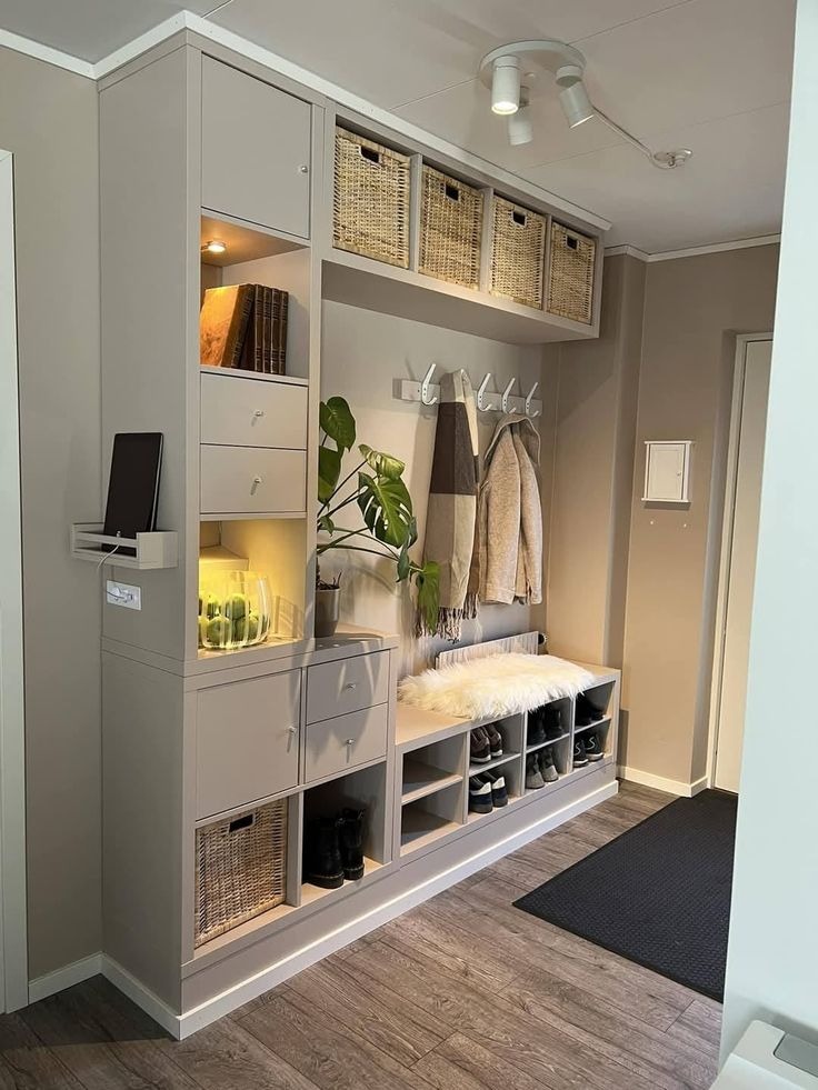 Modern mudroom with built-in storage bench and woven baskets